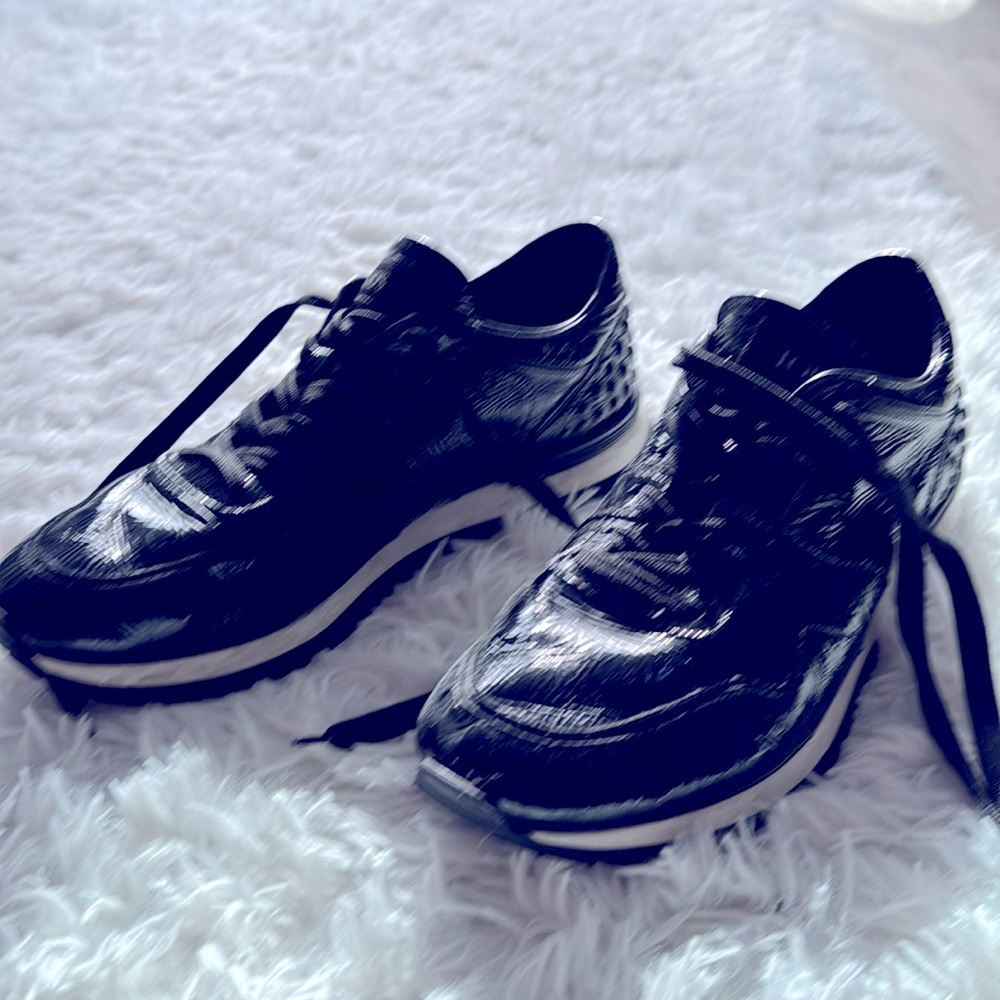 Tod’s Black sneakers — about 5 years old, good condition.